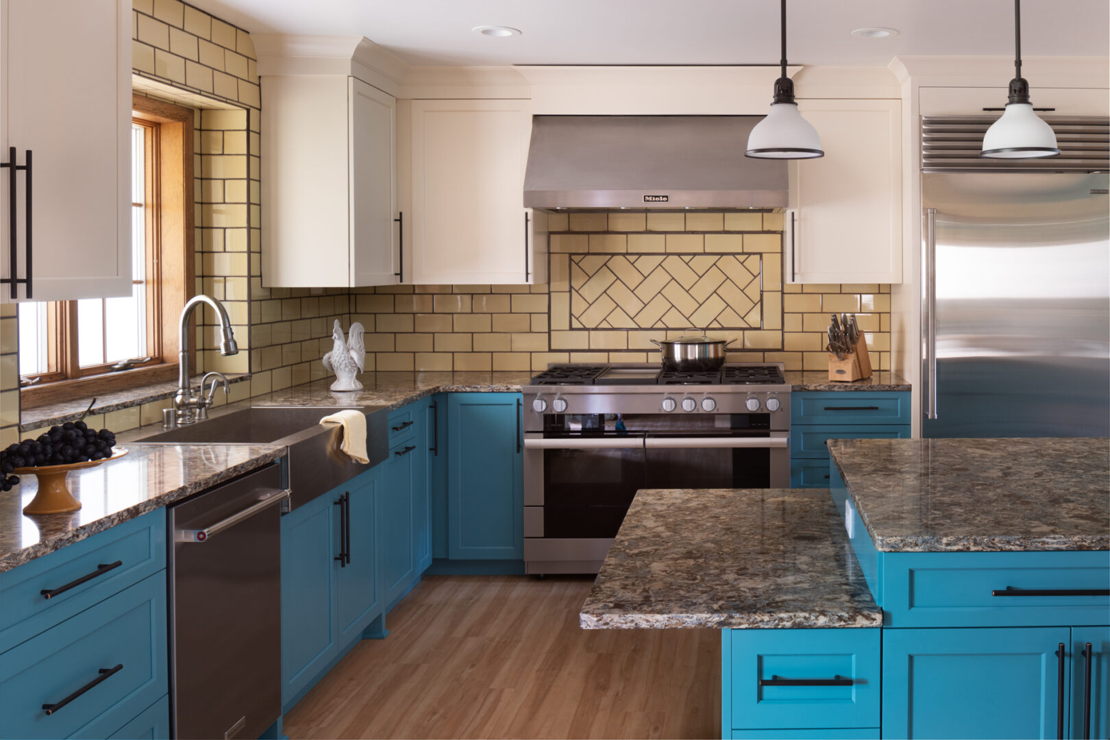 A furnished kitchen with blue cabinetry